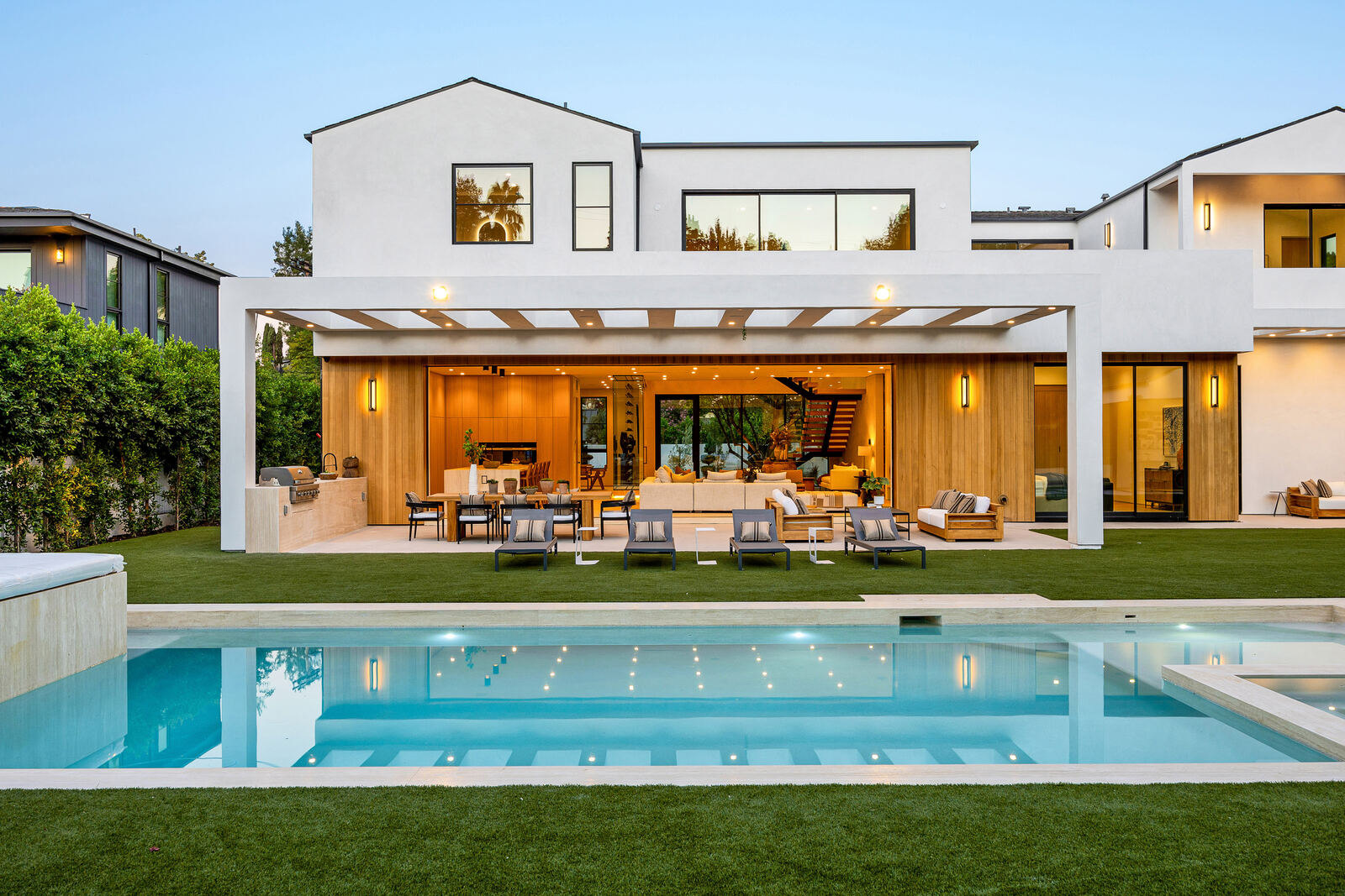 Covered outdoor living patio overlooking a Los Angeles pool